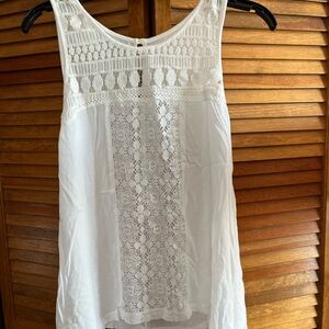 Maurice’s white tank